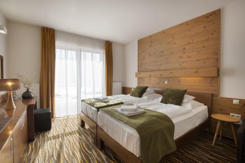 Postel nebo postele na pokoji v ubytování Equitana Hotel Resort