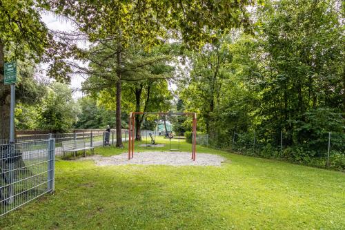 a park with a swing set in the grass at Omas Obstkiste in Stockach