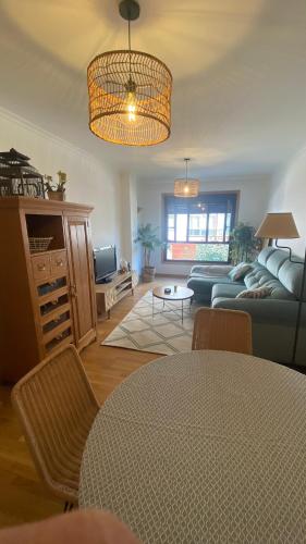 a living room with a couch and a table at Casa Sanjurjo in Monforte de Lemos