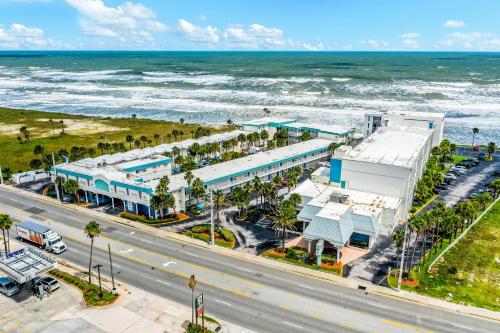 an aerial view of a building next to the ocean at Ocean Jewel Condos Unit 244 in Daytona Beach