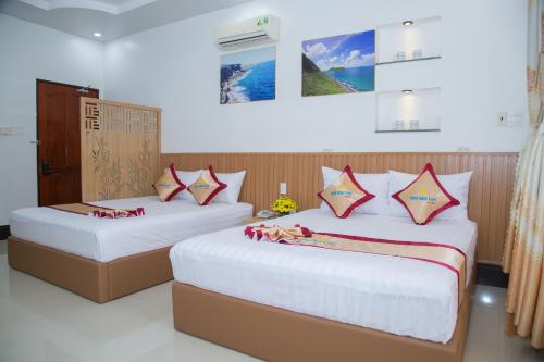 Ένα ή περισσότερα κρεβάτια σε δωμάτιο στο Minh Minh Nam 2 Hotel