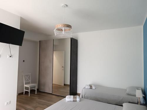 a bedroom with a basketball hoop hanging from the ceiling at dalie's house San Leone Centro in Agrigento