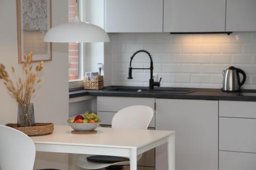 Η κουζίνα ή μικρή κουζίνα στο Apartment Am Teich