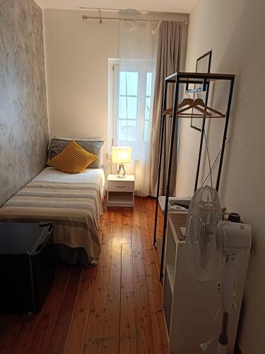a bedroom with a bunk bed and a window at Affittacamere La Loggia in Venzone