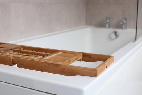 a wooden box sitting on top of a bathroom sink at Spacious 1 bedroom apartment in Leicester