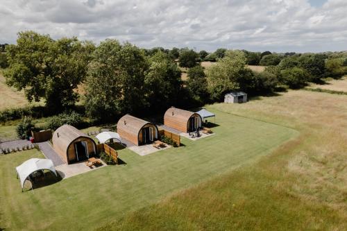 an overhead view of a group of tents in a field at Honeypot Hideaways Luxury Glamping - Exclusively for Adults in Chester