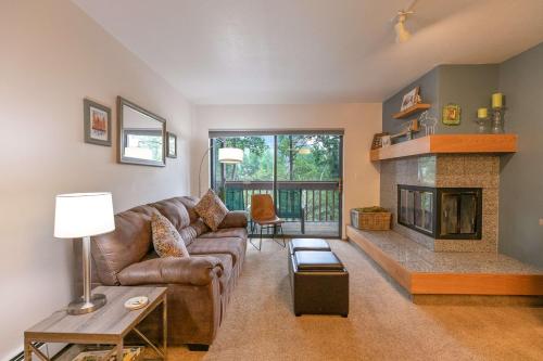 a living room with a couch and a fireplace at Lagoon Royal Townhome: Mountain Views Meet Modern Comforts in Frisco