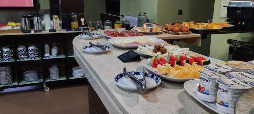 a buffet with many different types of food on a counter at Hotel A Bota in Sanxenxo