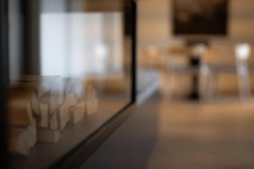 a close up of a glass window in a room at Victoria Hotel & Residence in Villars-sur-Ollon