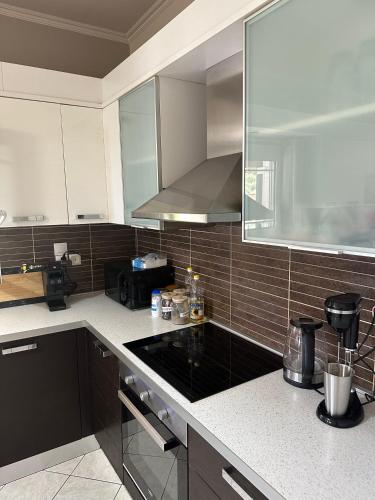 a kitchen with a stove top oven in a kitchen at Villa Long View in Avliótai