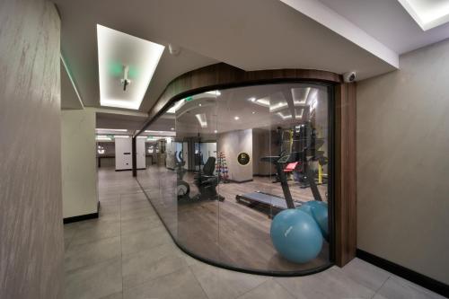 a large glass window in a room with a gym at Orka Royal Hotel & Spa in Istanbul