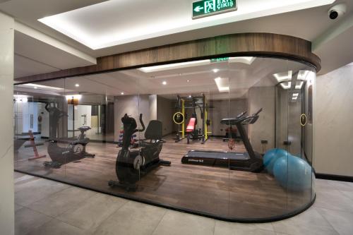 a gym with treadmills and exercise equipment in a room at Orka Royal Hotel & Spa in Istanbul