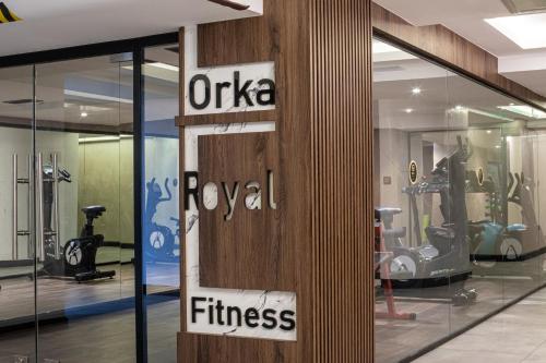 a gym with a sign that reads oasia royal fitness at Orka Royal Hotel & Spa in Istanbul