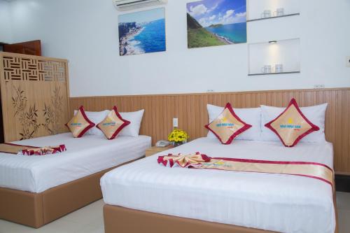 Ένα ή περισσότερα κρεβάτια σε δωμάτιο στο Minh Minh Nam 2 Hotel