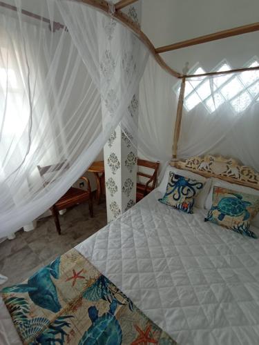 a bedroom with a bed in a tent at Villa Music of the ocean in Wadduwa