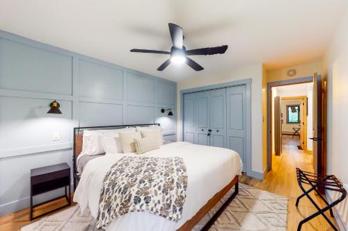 a bedroom with a bed and a ceiling fan at The Wedshire in Vail