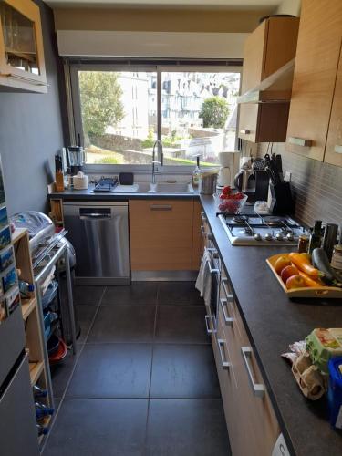 a kitchen with a sink and a counter top at Carpe Diem in Le Val-André