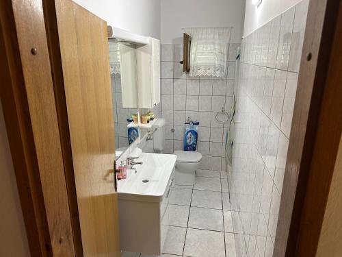 a bathroom with a sink and a toilet at Apartment Jelić in Duće