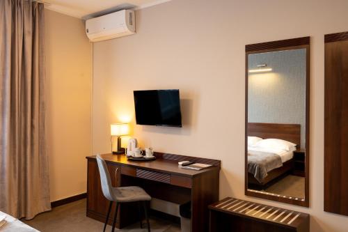 Una cama o camas en una habitación de Hotel Pod Jesiotrem