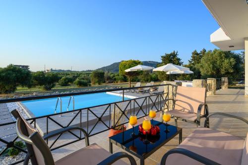 a balcony with a view of a swimming pool at El Paradiso in Pastida