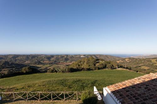 a view of the hills from the roof of a house at Agroturismo Son Vives Menorca - Adults Only in Ferreries