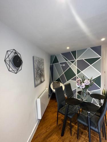 a dining room with a table and chairs at 2 Southwell Road - Luxurious City Centre Apartments in Norwich