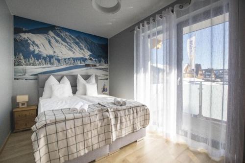 מיטה או מיטות בחדר ב-Apartament Góral-Ski 2