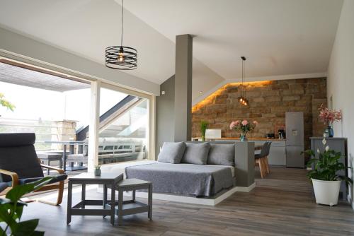 a living room with a bed and a dining room at Aparthotel am Zwinger in Dresden