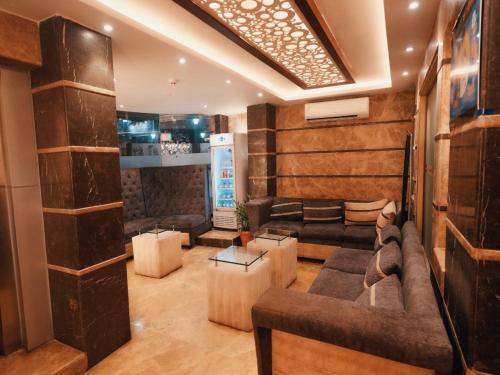a living room with a couch and a table at Aparupa Ambience in Port Blair