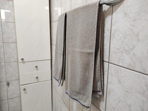 a towel hanging on a towel rack in a bathroom at City Center in Visoko