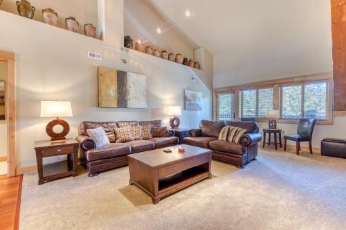 a living room with couches and a coffee table at #404 Grand Lodge South Penthouse in Government Camp