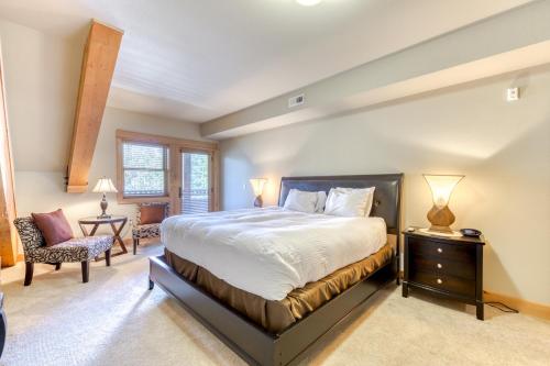 a bedroom with a large bed and a chair at #404 Grand Lodge South Penthouse in Government Camp