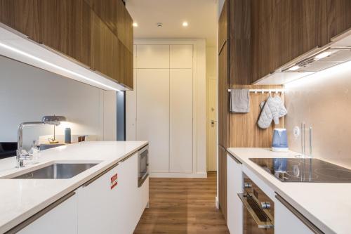 a kitchen with a sink and a refrigerator at Lisbon Marquês de Pombal, TTLDL42 in Lisbon