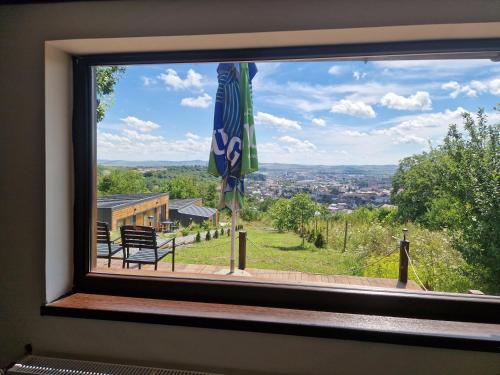 a window with a view of a city through it at Bella Vista Turda in Turda