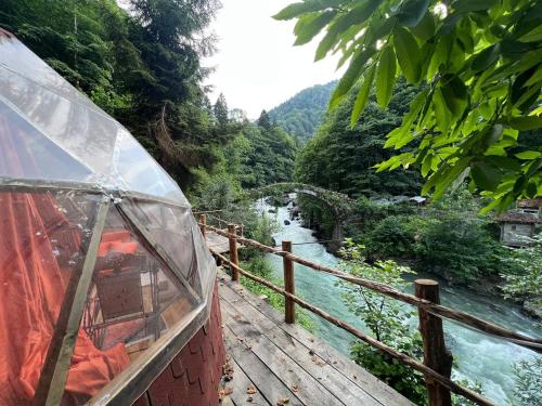 a view of a river from a boat on a bridge at Siya dome & glamping in Çamlıhemşin