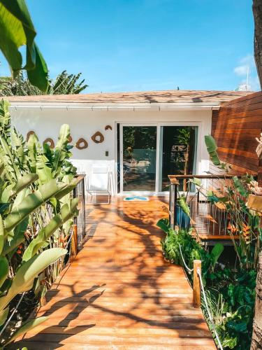 a patio with a bunch of plants in front of a house at Dolphin Hotel in Fernando de Noronha