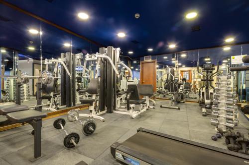 a gym with lots of equipment in a room at Gordion Hotel - Special Class in Ankara