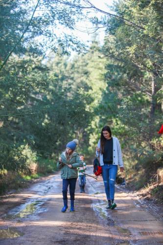 a couple of people walking down a dirt road at A Hilltop Country Retreat in Swellendam