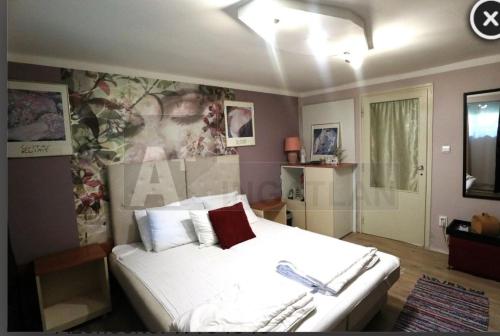 a bedroom with a large white bed in it at D6 apartment in Szeged