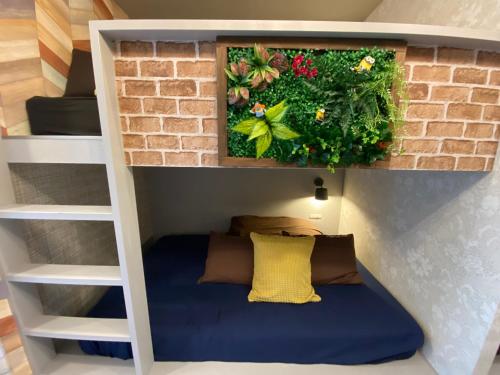 a bunk bed in a tiny house at Hotel Jungle fun fun in Osaka