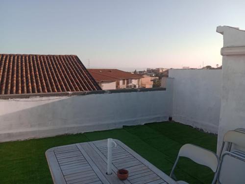 a balcony with a green lawn on a roof at A Catania Vicino l'Etna in Tremestieri Etneo
