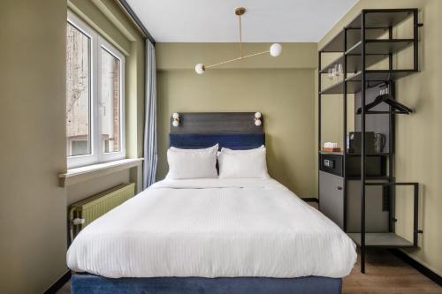Un ou plusieurs lits dans un hébergement de l'établissement numa I Scoop Rooms & Apartments