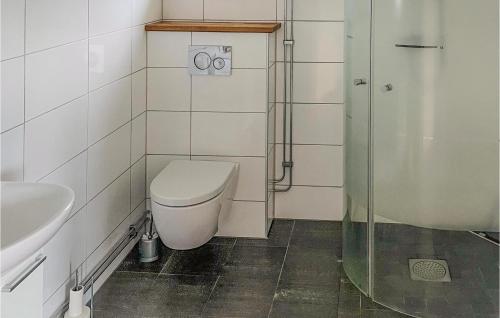 a bathroom with a toilet and a sink and a shower at Stunning Home In Tingsryd With Wifi in Tingsryd