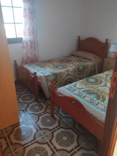 A bed or beds in a room at Vivienda vacacional