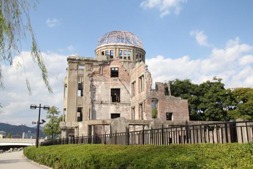 an old building with an observatory on top of it at Hiroshima City Bunka Koryu Kaikan in Hiroshima