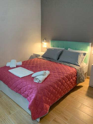 a bedroom with a bed with a laptop on it at TRADITIONAL HOUSE ALEPIS IN AREOPOLIS in Areopolis