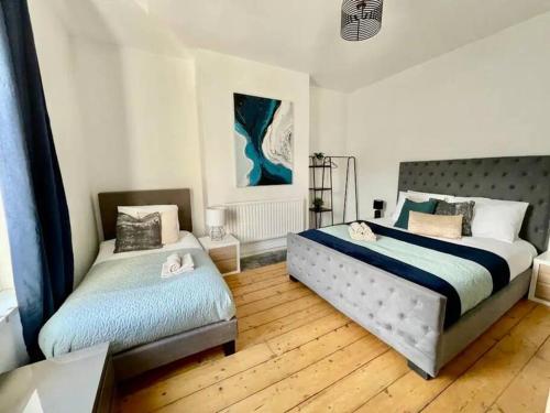 a bedroom with two beds in a room at Brewery Loft in Newport