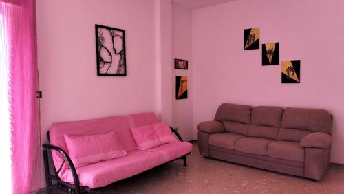 a living room with a couch and a chair at Casa Vacanza Casale in Brindisi