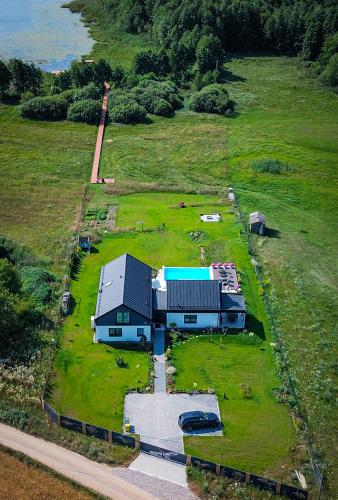 an aerial view of a house in a field at Dwa Żurawie - Głuszyn in Głuszyn
