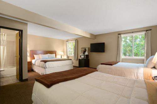 Ένα ή περισσότερα κρεβάτια σε δωμάτιο στο Days Inn by Wyndham Pierre